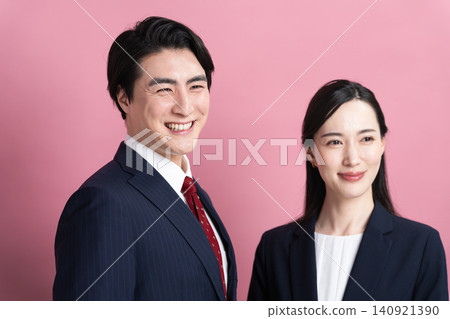 Young men and women in business suits - Business image Young men and women in business suits - Business image 140921390