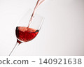 Red wine poured into a glass 140921638
