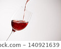 Red wine poured into a glass 140921639