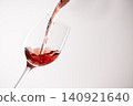 Red wine poured into a glass 140921640