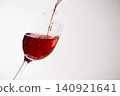 Red wine poured into a glass 140921641