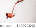 Red wine poured into a glass 140921642