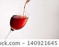 Red wine poured into a glass 140921645