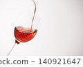 Red wine poured into a glass 140921647