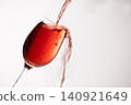 Red wine poured into a glass 140921649