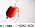 Red wine poured into a glass 140921650