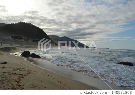 A scene of a sandy beach on the Sea of Japan (known as the East Sea in Korea) near Jeongdongjin, South Korea. A scene of a sandy beach on the Sea of Japan (known as the East Sea in Korea) near Jeongdongjin, South Korea. 140921868
