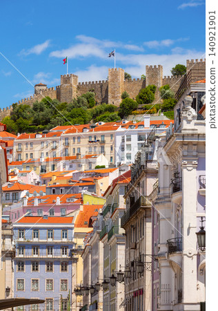 Sao Jorge Fortress above historic rooftops in Lisbon, Portugal 140921901