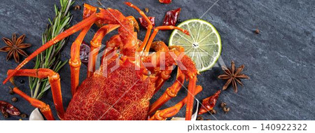 Crab with lemon slice and herbs on dark surface Crab with lemon slice and herbs on dark surface 140922322