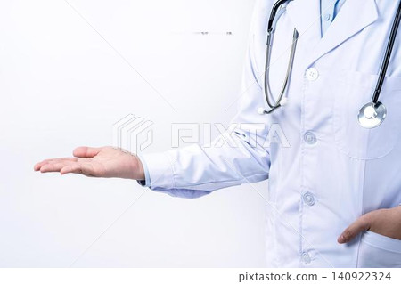 Doctor in white coat with stethoscope gesturing with hand Doctor in white coat with stethoscope gesturing with hand 140922324