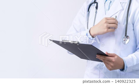Doctor in white coat with stethoscope holding clipboard Doctor in white coat with stethoscope holding clipboard 140922325