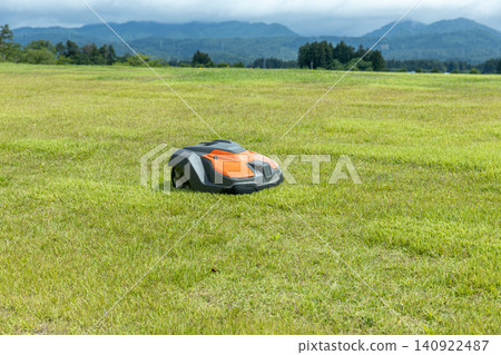 Robot lawnmower for mowing the grass in the square Robot lawnmower for mowing the grass in the square 140922487