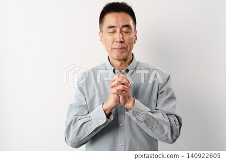 A senior man in casual clothes standing – a lifestyle image. A senior man in casual clothes standing – a lifestyle image. 140922605
