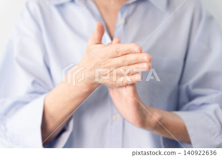 A senior woman in casual clothes standing – a lifestyle image. A senior woman in casual clothes standing – a lifestyle image. 140922636