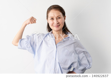 A senior woman in casual clothes standing – a lifestyle image. 140922637