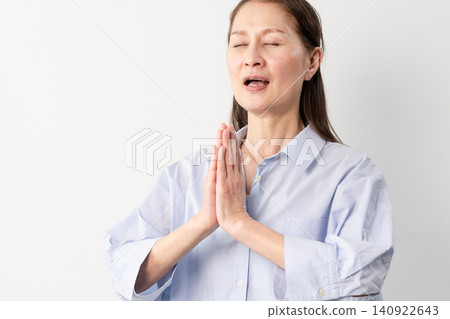 A senior woman in casual clothes standing – a lifestyle image. A senior woman in casual clothes standing – a lifestyle image. 140922643
