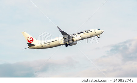 JAL (Japan Airlines) passenger plane ascending after takeoff JAL (Japan Airlines) passenger plane ascending after takeoff 140922742