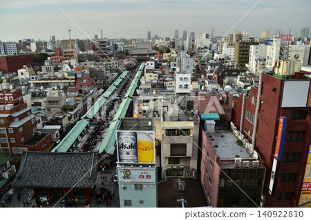 A street scene around Senso-ji Temple in Asakusa, Tokyo, Japan, in spring: Kaminarimon Gate, Nakamise Street, and tourists; an aerial photograph taken from a diagonal angle. A street scene around Senso-ji Temple in Asakusa, Tokyo, Japan, in spring: Kaminarimon Gate, Nakamise Street, and tourists; an aerial photograph taken from a diagonal angle. 140922810