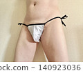 A man with metabolic syndrome in his underwear, facing right, wearing white. 140923036