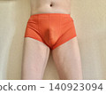A man with metabolic syndrome in his underwear, front view, orange. 140923094