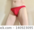 A man with metabolic syndrome in his underwear, facing right, wearing red. 140923095