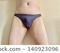 A man with metabolic syndrome in his underwear, front view, blue. 140923096