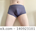 A man with metabolic syndrome in his underwear, front view, blue. 140923101