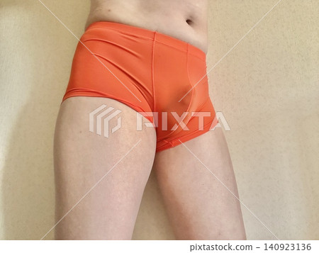 A man with metabolic syndrome in his underwear, facing left, orange. A man with metabolic syndrome in his underwear, facing left, orange. 140923136