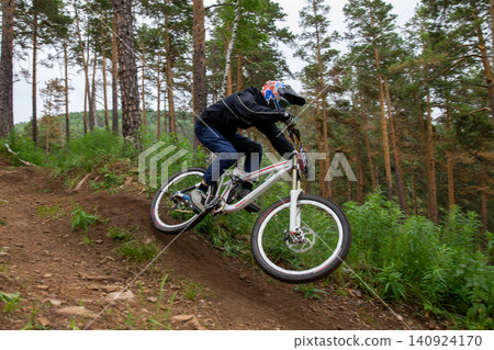 Athlete racer riding at speed Athlete racer riding at speed 140924170