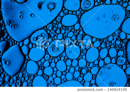 Vivid blue droplets and rounded cells spread across dark fluid background, creating scientific macro abstraction with glossy circles and organic texture Vivid blue droplets and rounded cells spread across dark fluid background, creating scientific macro abstraction with glossy circles and organic texture 140924199