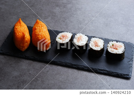 Negitoro rolls and inari sushi - A delicious-looking set of negitoro rolls and inari sushi 140924210