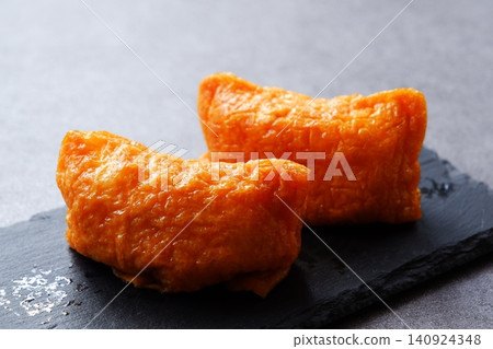 Inarizushi - Sweet and spicy fried tofu stuffed with vinegared rice 140924348
