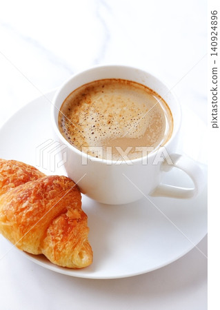 Croissants and Coffee - A breakfast scene with freshly baked croissants and freshly brewed cafe au lait 140924896