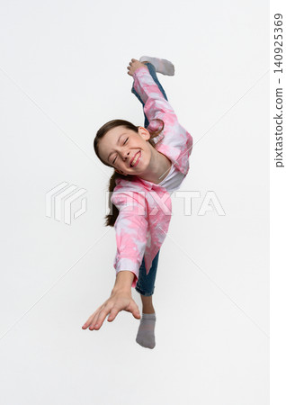 Flexible teenage girl balancing in advanced dance pose with eyes closed. Flexible teenage girl balancing in advanced dance pose with eyes closed. 140925369