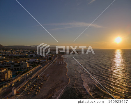 Drone View of Analipsi Beach and Coastal Promenade at Sunset in Crete Drone View of Analipsi Beach and Coastal Promenade at Sunset in Crete 140925457
