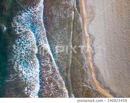 Top Down Aerial View of Sea Waves and Sandy Beach in Crete Greece 140925459
