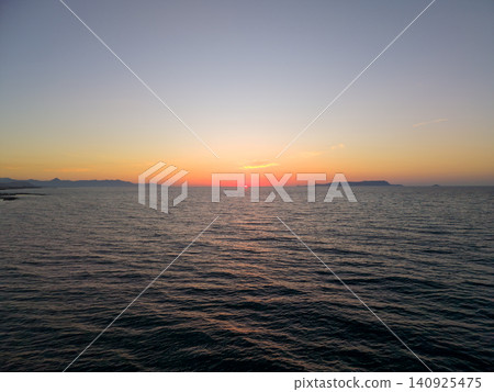 Scenic Aerial View of Sunset Over Mediterranean Sea in Crete Scenic Aerial View of Sunset Over Mediterranean Sea in Crete 140925475