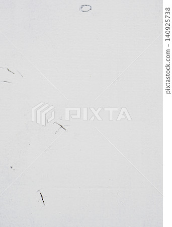 White-painted wood panels that allow the wood grain and knots to show through faintly. 140925738
