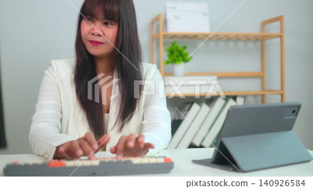 businesswoman working on computer businesswoman working on computer 140926584