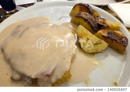 Creamy Sauced Cutlet with Roasted Potatoes - Perfect for Culinary Gourmets Creamy Sauced Cutlet with Roasted Potatoes - Perfect for Culinary Gourmets 140926897