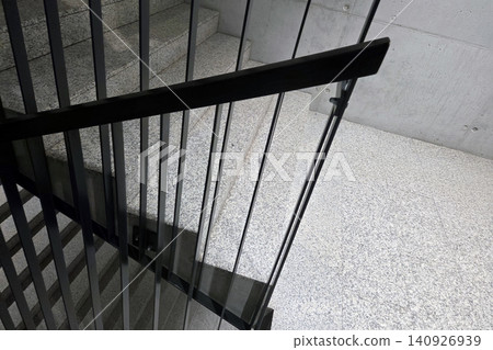Modern Architectural Staircase with Metal Railings and Concrete Design Elements for Interior Concepts 140926939
