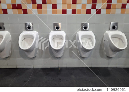 Public Restroom Design with Modern White Urinals and Tiled Wall Decor Public Restroom Design with Modern White Urinals and Tiled Wall Decor 140926961