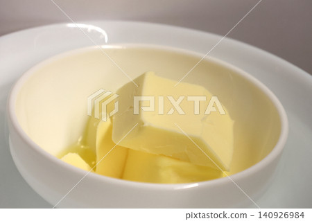 Fresh Butter Slices in White Bowl for Culinary and Recipe Design Fresh Butter Slices in White Bowl for Culinary and Recipe Design 140926984