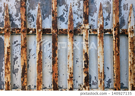 Rusty metal gates in an old building showing wear and tear over time 140927135