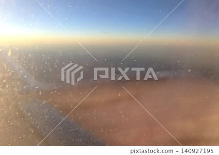 View Through Airplane Window at Sunset: Tranquil Travel Experience View Through Airplane Window at Sunset: Tranquil Travel Experience 140927195