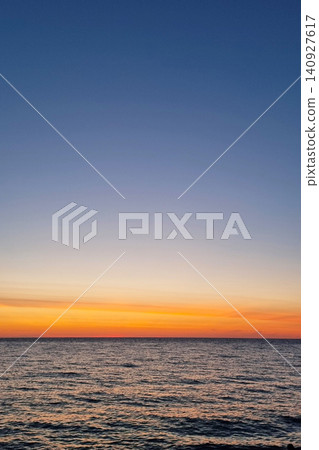 Serene Sunset Over Tranquil Ocean Horizon in Golden Hour Serene Sunset Over Tranquil Ocean Horizon in Golden Hour 140927617