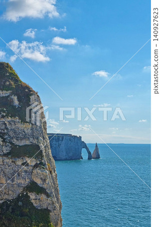 Majestic Cliffs and Natural Arch Overlooking the Blue Sea on a Sunny Day Majestic Cliffs and Natural Arch Overlooking the Blue Sea on a Sunny Day 140927623