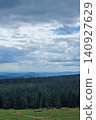 Scenic Mountain Landscape with Pine Forest and Cloudy Sky 140927629