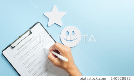 Hand completes customer satisfaction survey form, providing valuable business data feedback, check review for service, smiley face and star icons stand out on blue background Hand completes customer satisfaction survey form, providing valuable business data feedback, check review for service, smiley face and star icons stand out on blue background 140928982