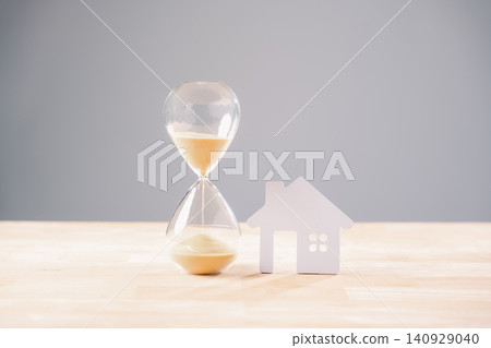 Hourglass time house home money mortgage concept, sand flowing, real estate investment, loan, property, building, buying, selling, accommodation, temporary Hourglass time house home money mortgage concept, sand flowing, real estate investment, loan, property, building, buying, selling, accommodation, temporary 140929040